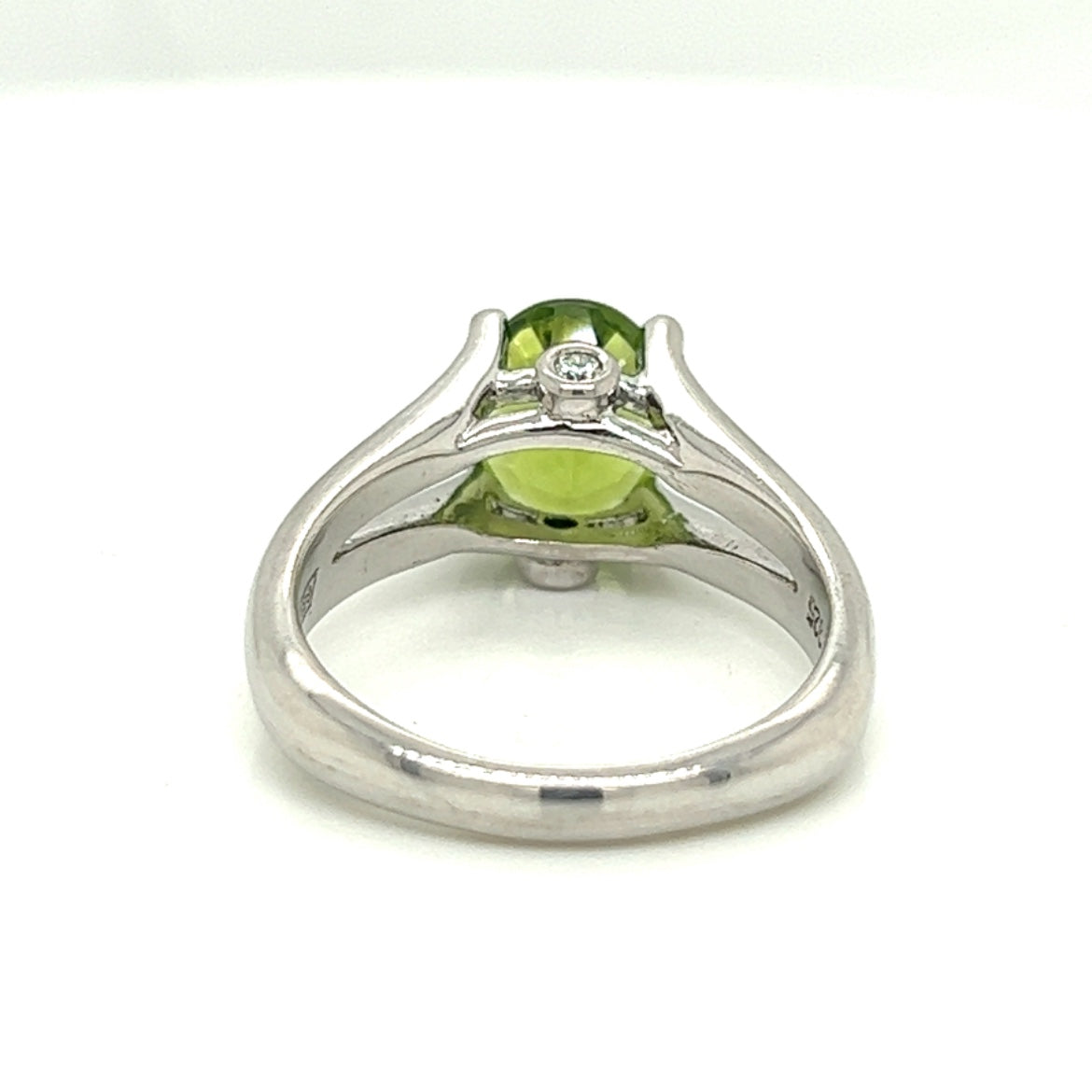 Oval Peridot Gemstone With Two Bezel Set Diamonds Set On The Side