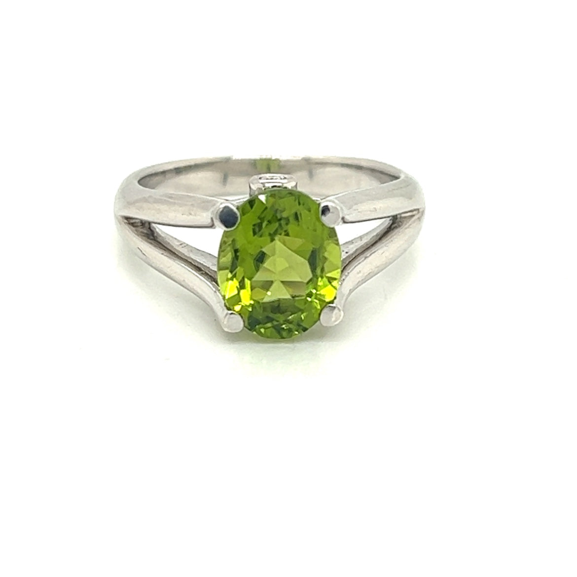 Oval Peridot Gemstone  With Two Bezel Set Diamonds Set On The Side