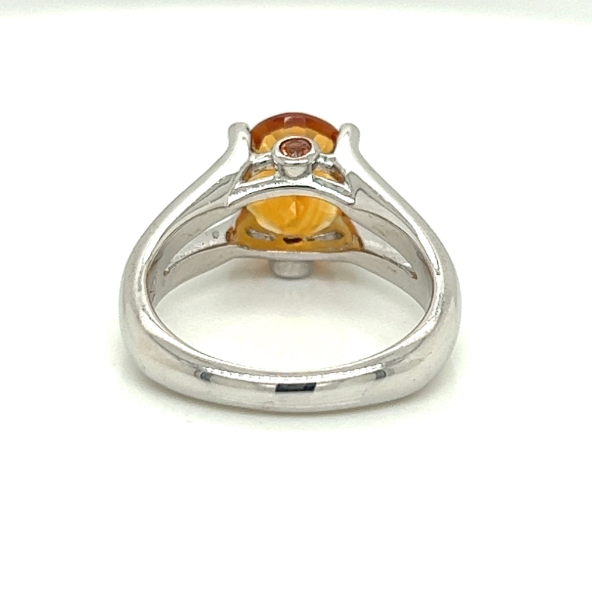 Oval Citrine Gemstone  With Two Bezel Set Orange Sapphire Gemstones Set On The Side